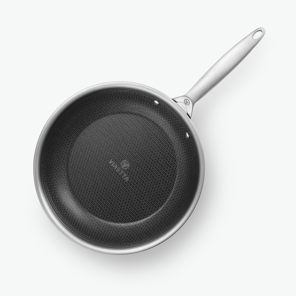 Stekpanna i 3-Ply Hybrid, Ø28 cm, sedd ovanifrån med det sexkantiga mönstret