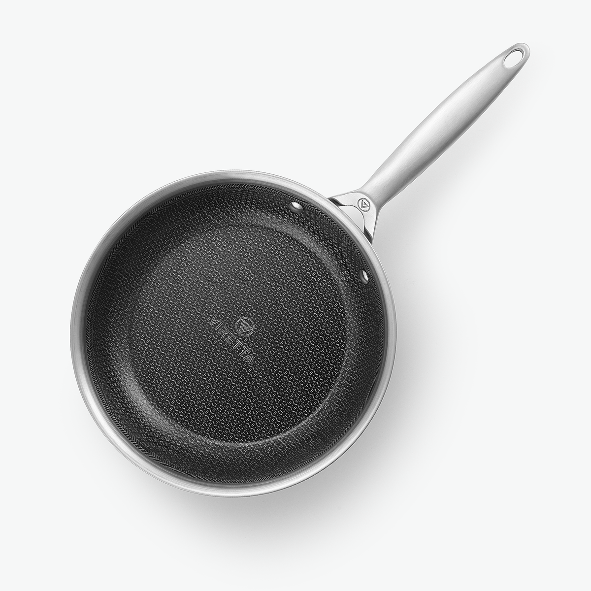 Stekpanna i 3-Ply Hybrid, Ø24 cm, sedd ovanifrån med det sexkantiga mönstret