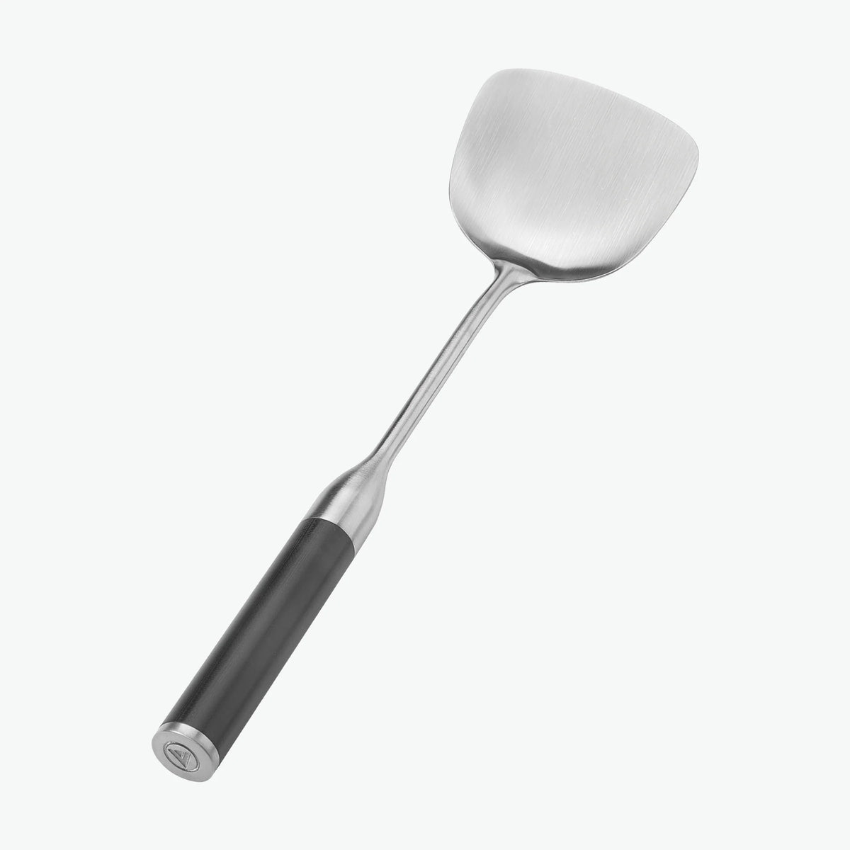 Stekspade med handtag i G-10, sedd snett