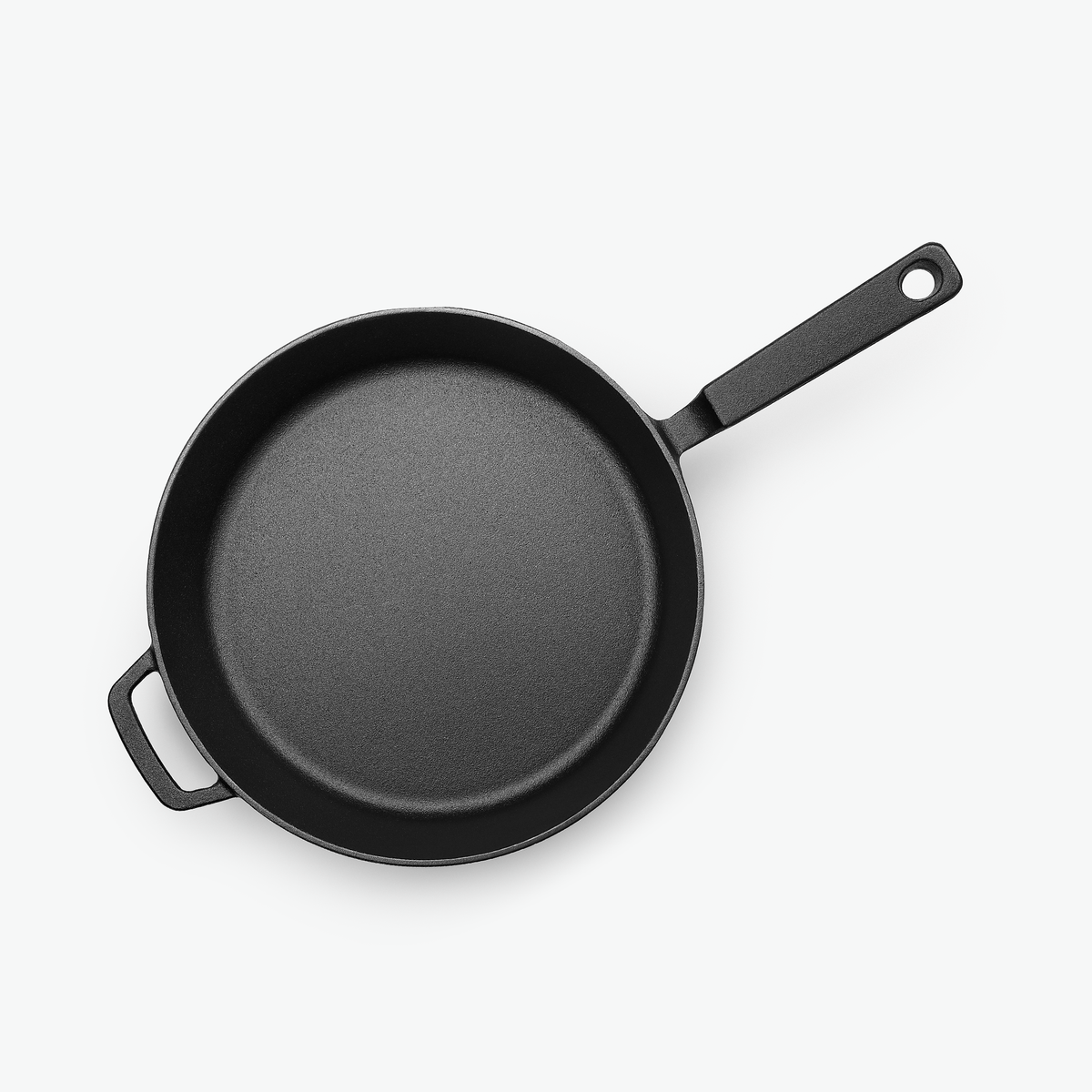 Gjutjärnspanna Ø28 cm sedd ovanifrån med stekytan i obehandlat gjutjärn