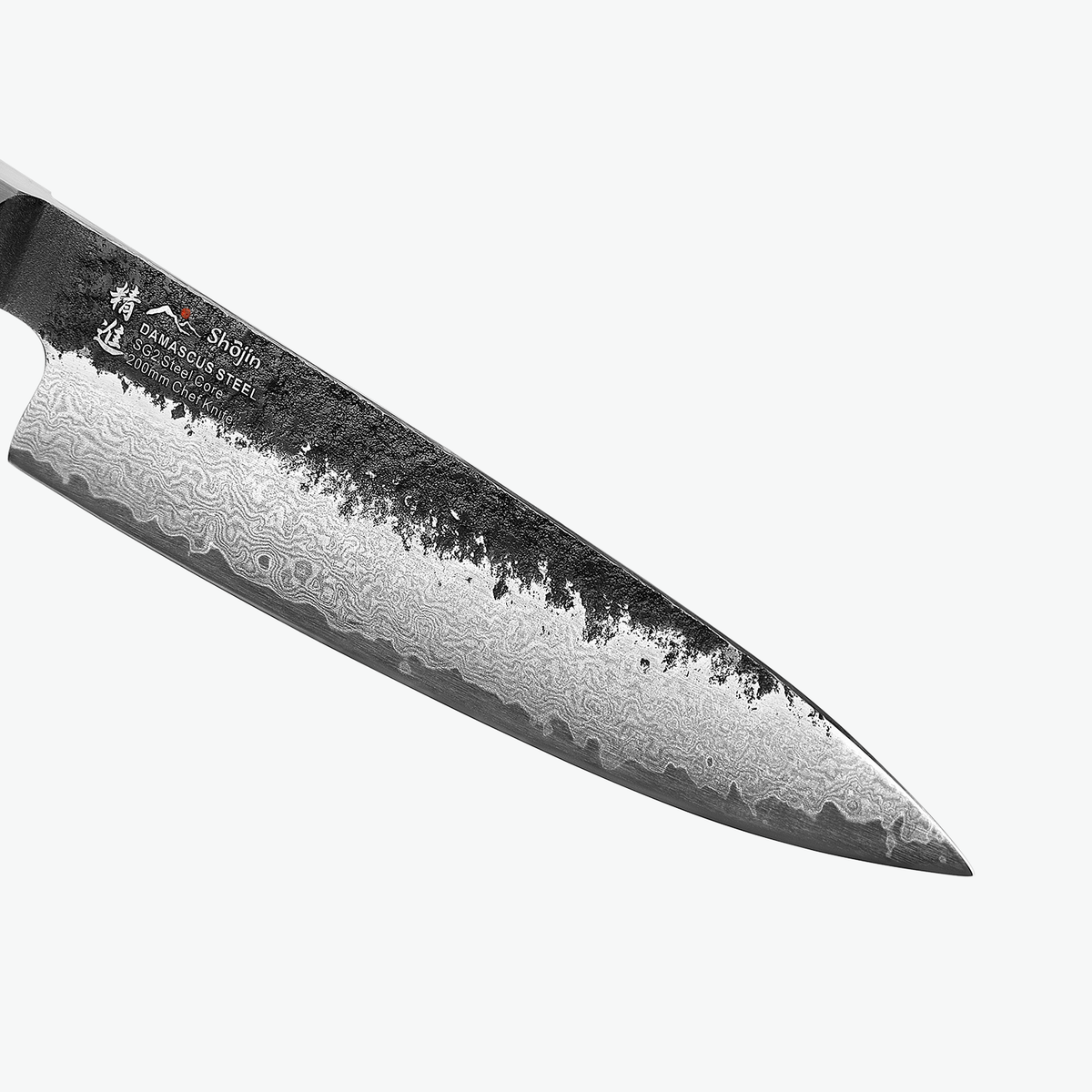 Mörk rygg och damaskusmönster på bladet på Shōjin Kashi kockkniv, i närbild